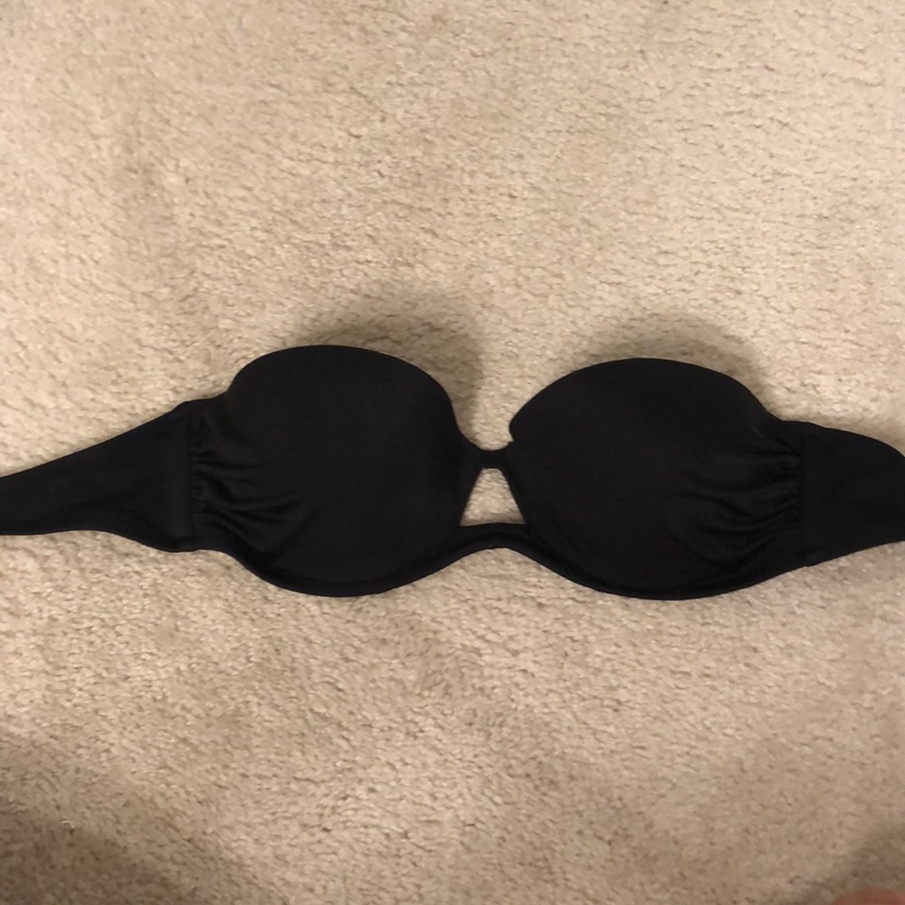 Black strapless swim suit top with triangle cutout